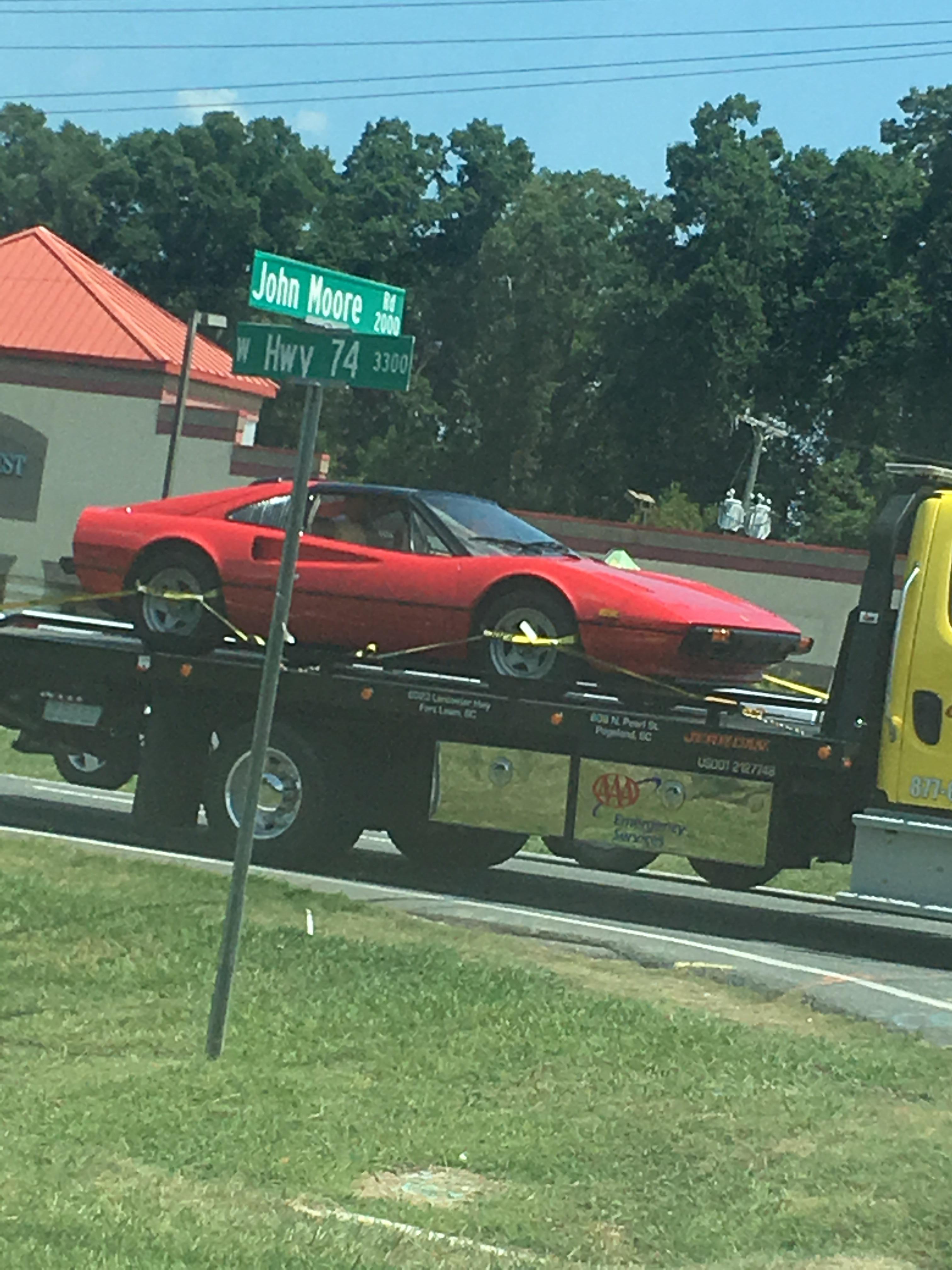 The rare Ferrari returning to its natural habitat: the mechanic's shop.